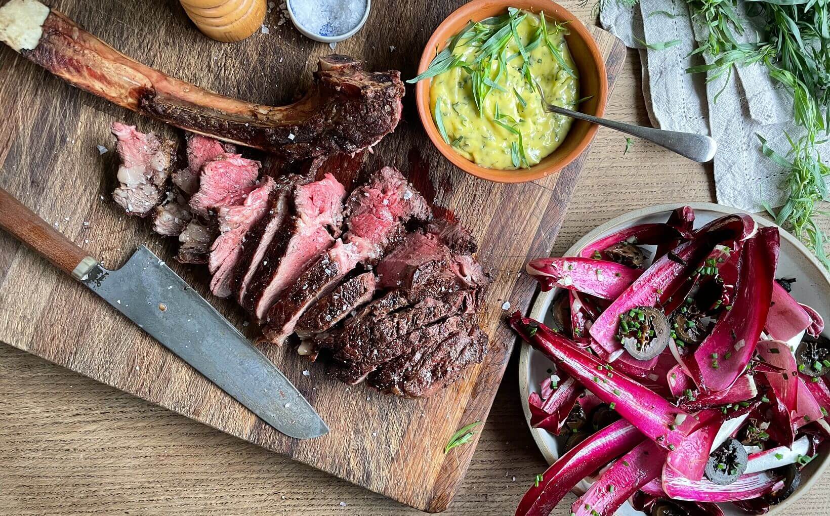 Wagyu beef steak being pan-seared in cast iron skillet to showcase proper cooking technique