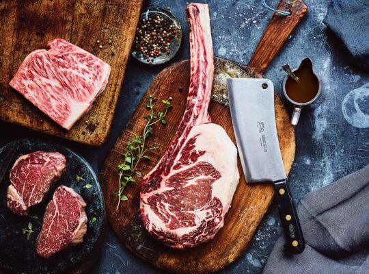 Japanese Wagyu cattle grazing on pasture, known for producing highly marbled premium beef