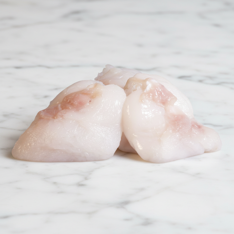Cod Cheeks on white marble