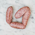 Italian Pork Sausages on white marble