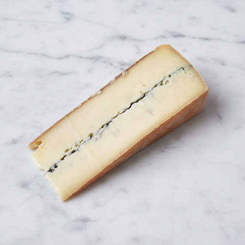 Morbier Fermier on white marble